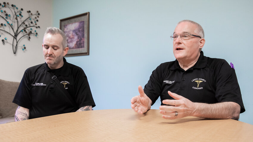 Coroner Warren McLeod, right, talks about facts in the Aron Christensen case alongside Chief Deputy Coroner Steven Wilson in Chehalis on Tuesday, April 18, 2023.