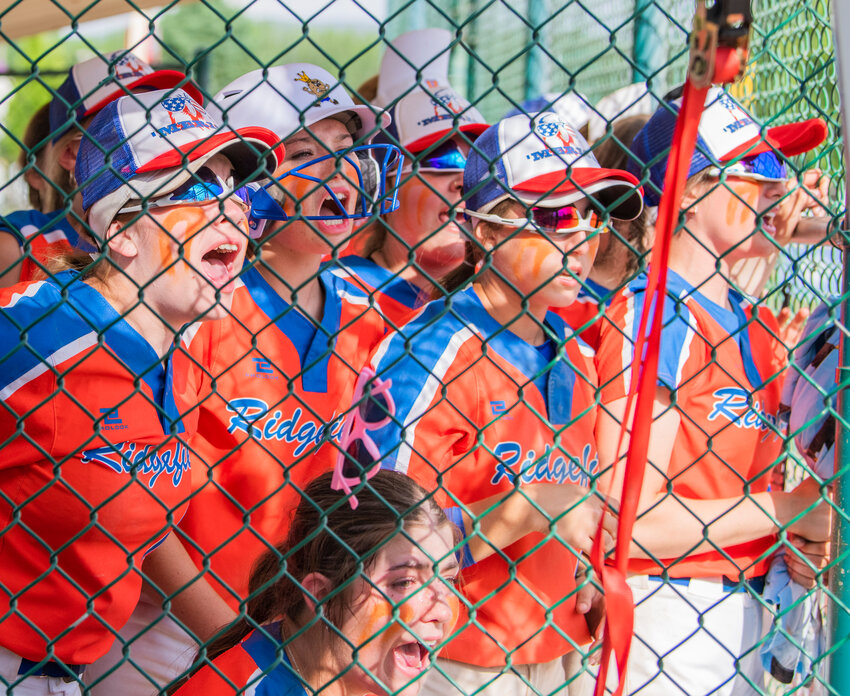 Ridgefield players cheer on their teammates during the 2A state title game against North Kitsap at Carlon Park in Selah on Saturday, May 27.