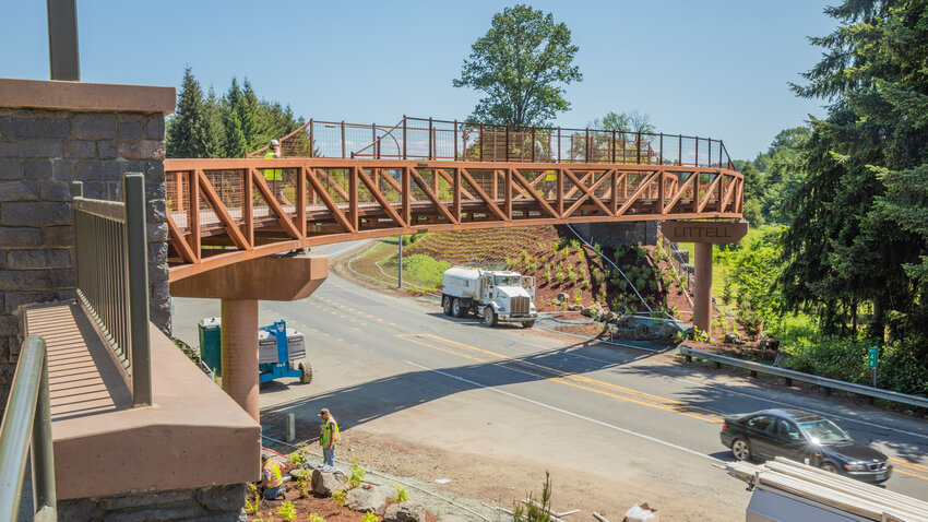 Crews put finishing touches on landscape and infrastructure surrounding the newly opened section of the Willapa Hills State Park Trail in Littell on Friday, June 2. The new bridge over state Route 6 was completed late last month and opened to the public this week. Completion of this bridge provides continuous trail for 28 miles, reaching well into Pacific County. Construction was originally scheduled for completion in 2022 but the project was delayed. The purpose of the project is to separate vehicles traveling on state Route 6 from visitors using the Willapa Hills Trail.