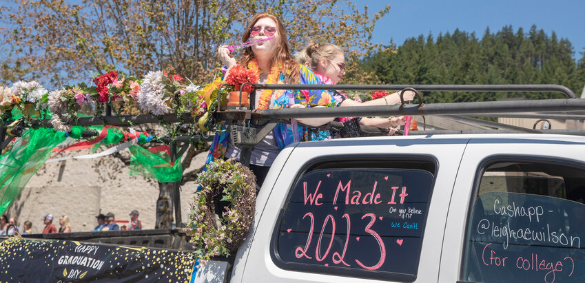 W.F. West High School senior Leigha Wilson blows bubbles during a parade honoring future graduates in Chehalis on Sunday, June 4.