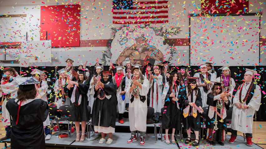 Confetti rains down on graduates from Oakville High School on Saturday, June 17.