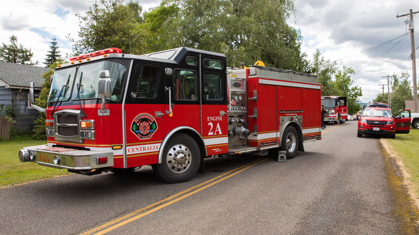 Centralia police, Chehalis firefighters and crews from Riverside Fire Authority respond to the scene of a structure fire inside an outbuilding in the 600 block of State Street in Centralia last June.