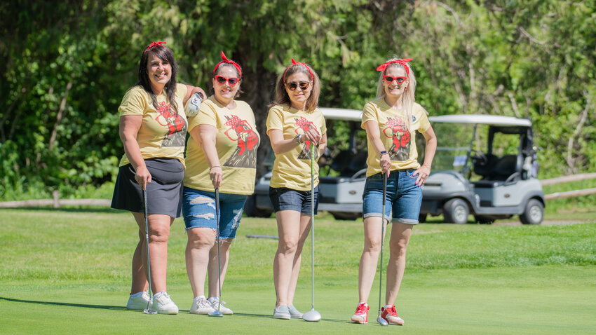 The Chicks and Sticks team from left, Shyanne Haney, Rae Toth, Stacie Belman and Melissa Baumgarten smile for a photo during a Hope Alliance golf tournament fundraiser at Riverside Golf in Chehalis on Friday. Proceeds benefitted Hope Alliance, a local nonprofit that serves survivors of domestic violence and sexual assault. To learn more about Hope Alliance, visit https://hopealliancelc.org/.