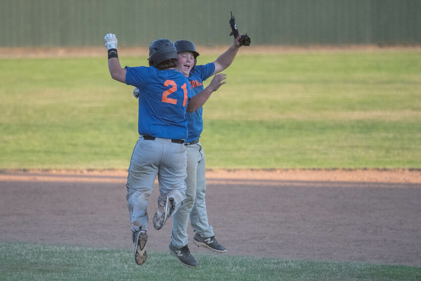 Marcus Miller celebrates with Jack Pendleton after Centralia's 16-15 walk-off win over RBI on June 28 at Wheeler Field.