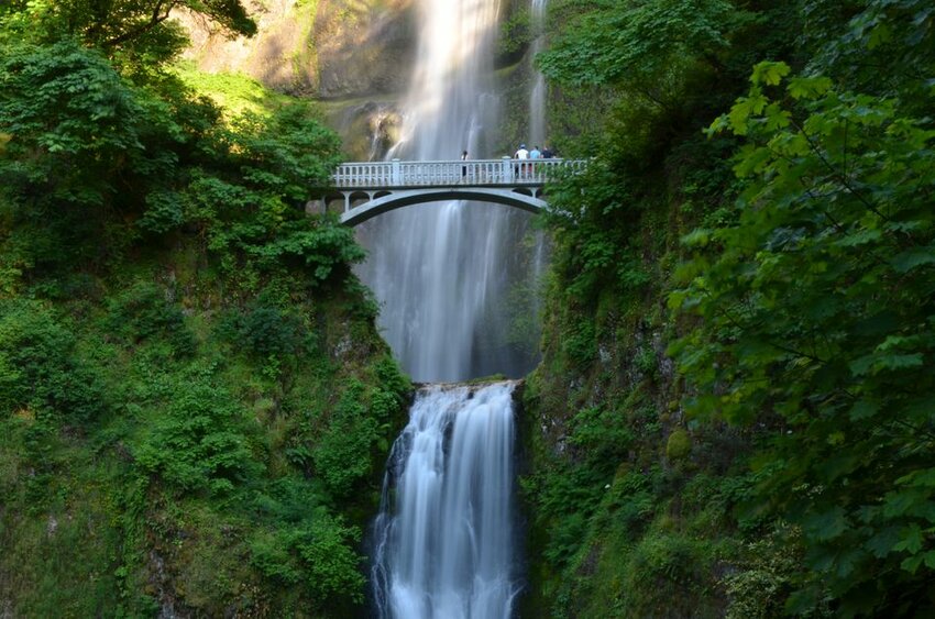 Visitors gather on the Benson Bridge at Multnomah Falls in the Columbia River Gorge.