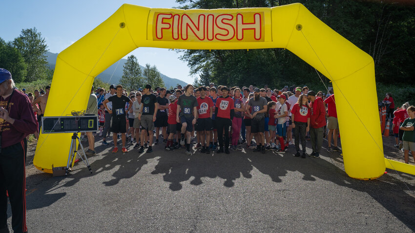 Runners line up and prepare to start the Mossyrock Independence Day 5K &amp; 8K at the Mossyrock Dam Sunday, July 2, 2023.