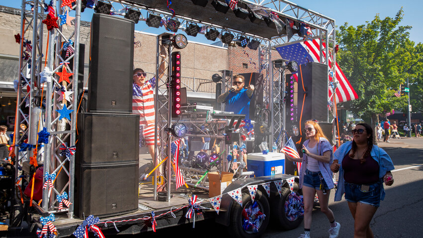 DJ Sound Dragon blasts music through the streets of Centralia during the Summerfest parade on Tuesday.