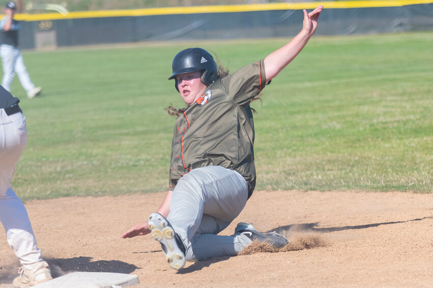 R.J. Workman slides safely into third base during RBI's 9-8 win over LCBC on July 6 at Castle Rock.