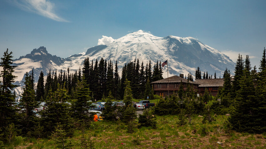 Mount Rainier towers over the horizon beyond the Sunrise Visitor Center on Thursday, July 6.