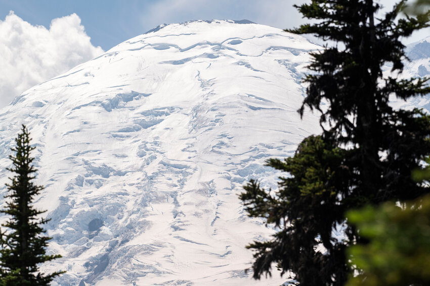 From about 6,400-foot elevation at Sunrise, Mount Rainier&rsquo;s summit and its eastern face, covered in ice caves, crevices and glaciers, are visible last July.