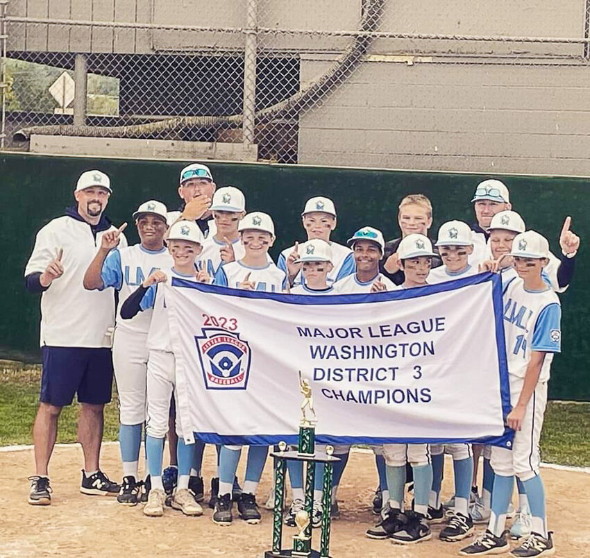 The Larch Mountain Little League 12-year old team poses with its trophy after winning the District 3 title July 7.