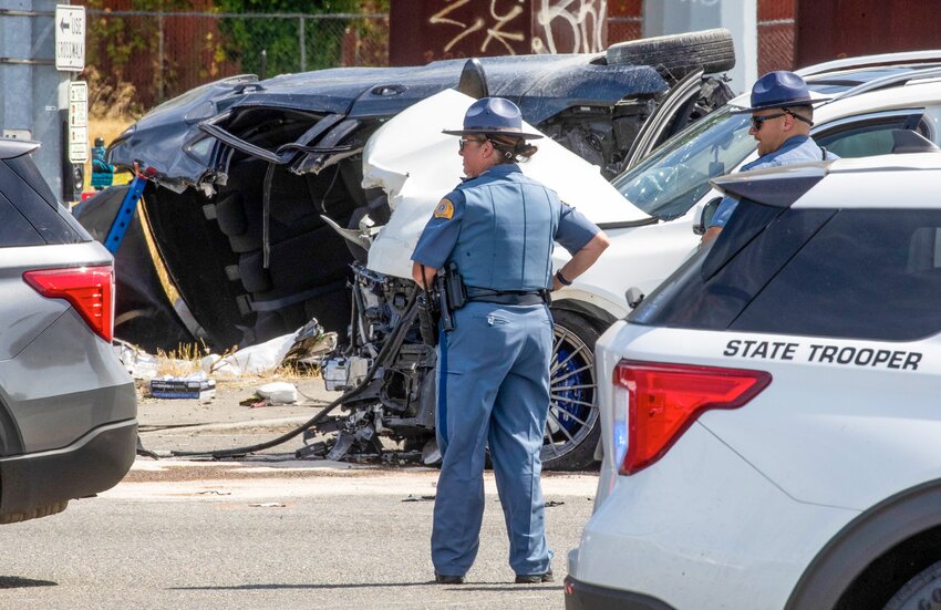 First responders investigate a crash that left six dead and three others injured on Sunday, July 16, 2023, in Tacoma. (Luke Johnson/The Seattle Times/TNS)