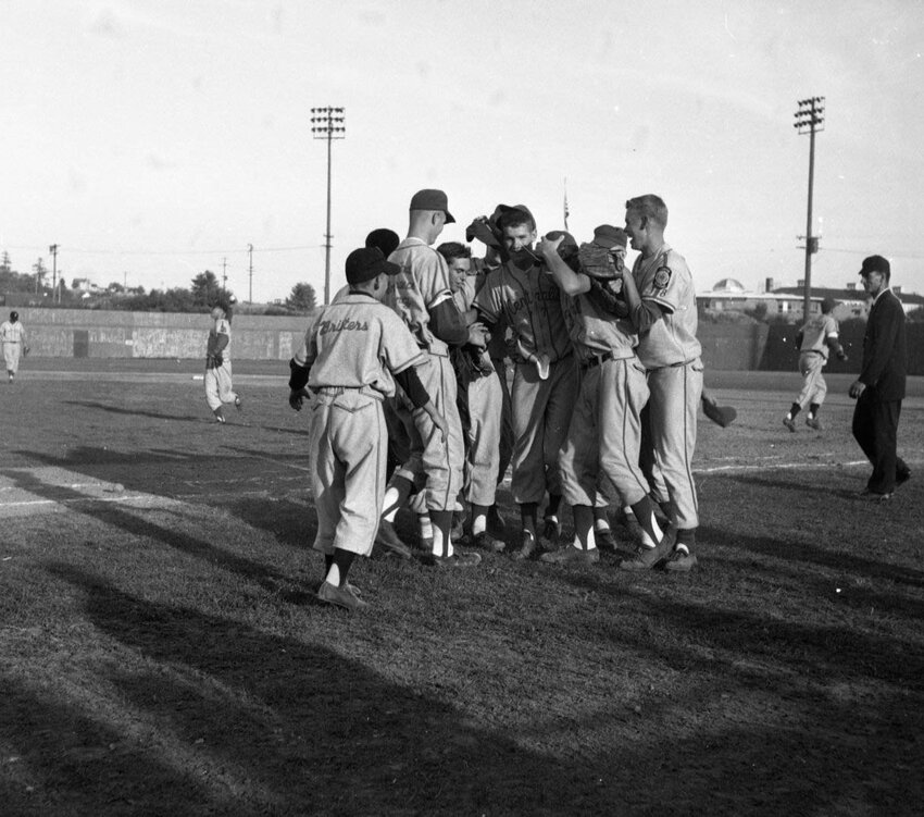 The Centralia Grant Hodge Post celebrates the final out after winning the Washington Junior Legion championship at Tacoma's Cheney Stadium on Aug. 15, 1965.