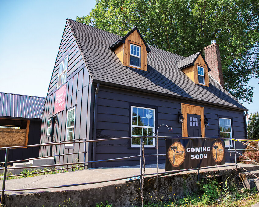 An old, but remodeled, cottage faces the Main Street side of Tukes Taphouse.