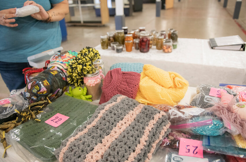 Misty Cline, of Onalaska, lays out more than 85 handmade items that she intends to enter into the Southwest Washington Fair&rsquo;s open class home arts department during an interview at the fairgrounds on Tuesday.