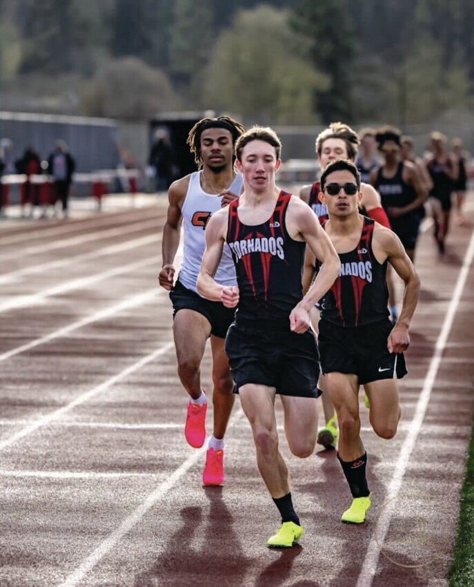 Zach Walsh runs at a Yelm High School track meet in the 2023 season.