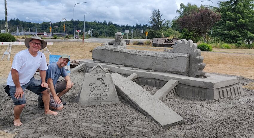 Jim Butler and Eric Wilber are pictured with their finished sculpture at the Northwest Carriage Museum in Raymond in this photo by Laurie Bowman.