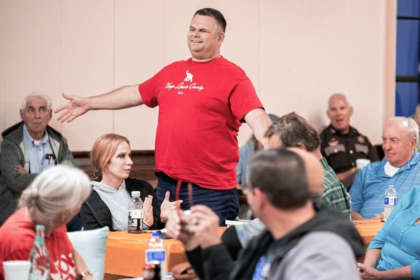 Morton Police Chief Roger Morningstar smiles and stands while sporting a shirt that reads, &ldquo;Keep Lewis County Red&rdquo; during a Lewis County Republicans meeting on the topic of filling the District 3 Commissioner position on October 4, 2021.