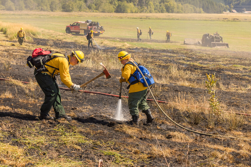 Riverside Fire Authority and crews from the Department of Natural Resources respond to a scene along Teitzel Road in Centralia on Thursday, August 3.