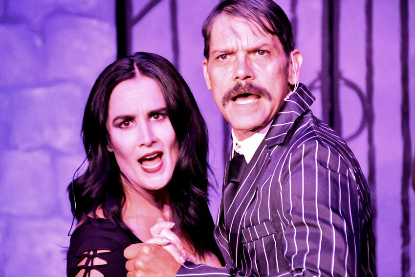 Morticia, played by Anastasia Cooper, and Gomez, played by Brian Green, perform on stage during dress rehearsals for &ldquo;The Addams Family&rdquo; at Roxy Theater in Morton in this photo captured by Marty Fortin.