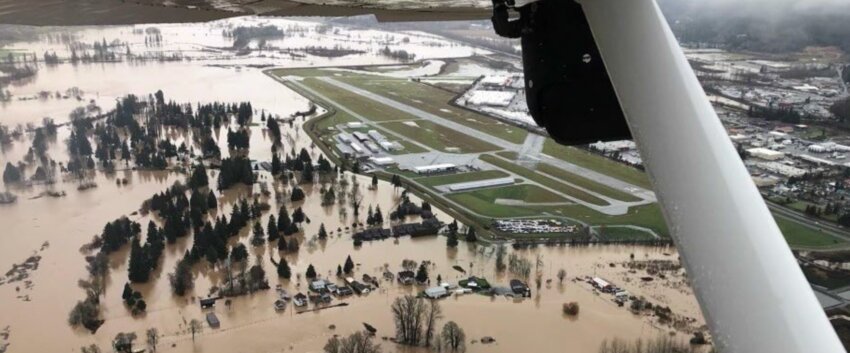 The Chehalis-Centralia Airport and surrounding businesses are seen protected from floodwater by the levee on Jan. 7, 2022, in this photo from Steve Bankuti and Tanner &ldquo;Scooter&rdquo;Mainero.