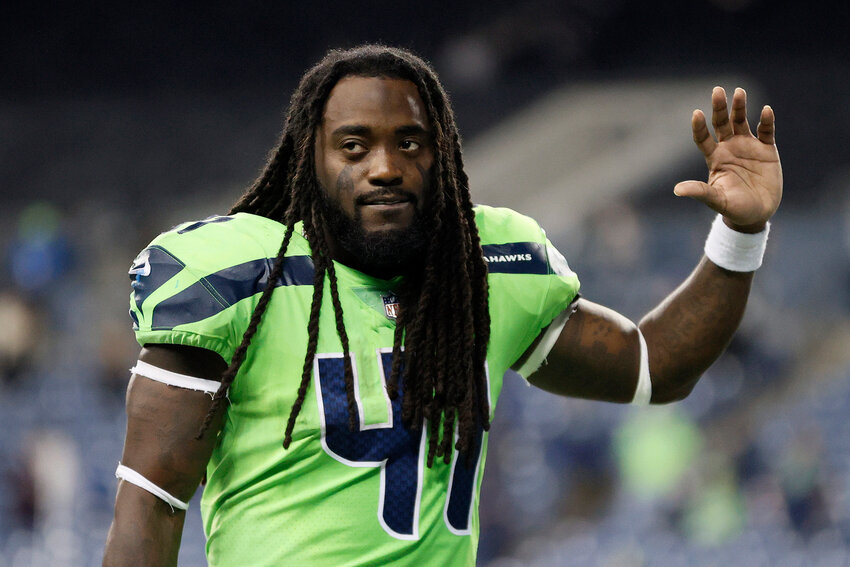 Alex Collins #41 of the Seattle Seahawks jogs off the field after losing 26-17 to the Los Angeles Rams at Lumen Field on October 07, 2021 in Seattle, Washington. (Photo by Steph Chambers/Getty Images)