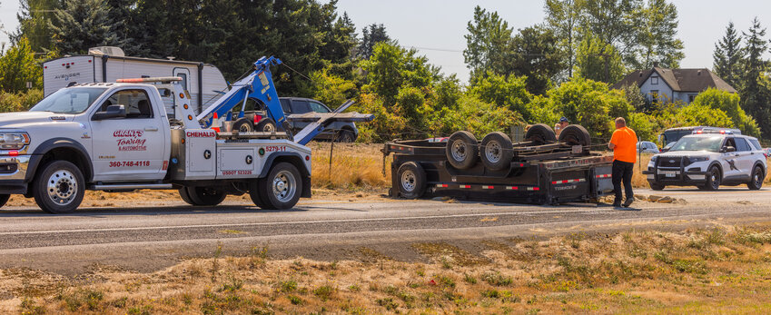 Crews from Grant&rsquo;s Towing work to remove a truck and trailer from the roadway near the intersection of Northwest Louisiana Avenue and Northwest Airport Road in Chehalis on Saturday, Aug. 19. The Chehalis Police Department had not released details of the crash by The Chronicle&rsquo;s deadline Monday afternoon. Look for an update in the Thursday edition of Sirens.