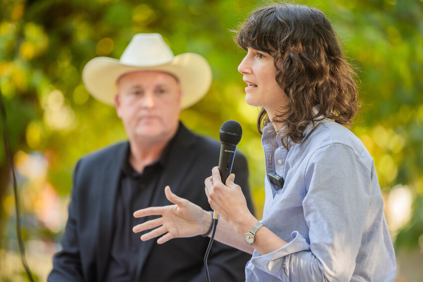Congresswoman Marie Gluesenkamp Perez talks alongside Commissioner Scott Brummer to a crowd of visitors at Kemp Olson Memorial Park in Toledo during a town hall event on Wednesday, Aug. 23.