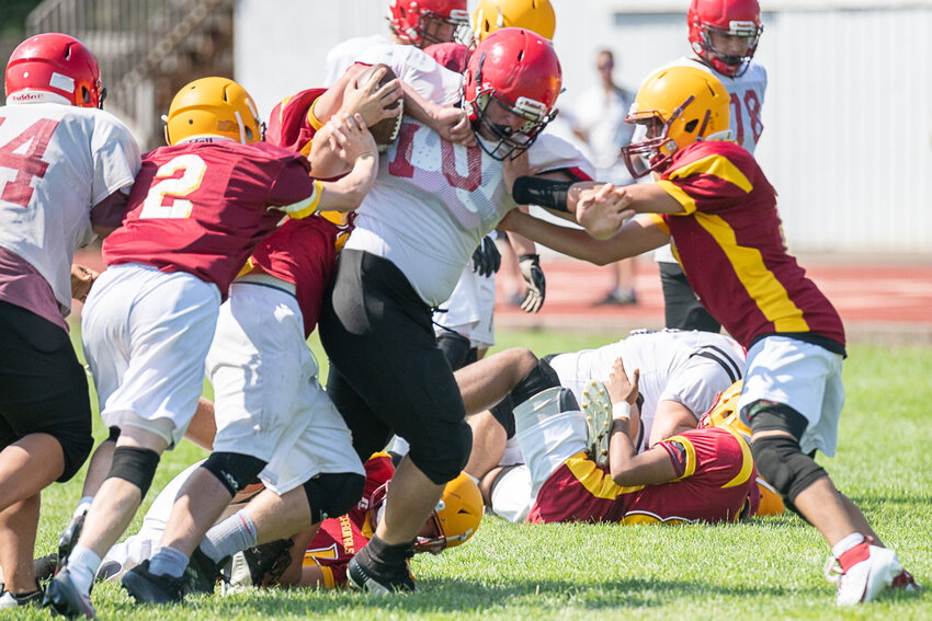 Marshall Brockway bowls his way through Winlock defenders during an 8-man jamboree on Aug. 26 at Winlock.
