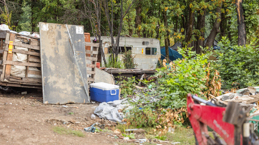 Trailers and trash are seen scattered across the landscape of the Blakeslee Junction encampment at the end of Eckerson Road in Centralia on Wednesday, Aug. 30.