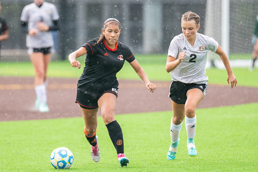 Centralia's Anahi Corona tries to get past Napavine's Ellie Gilbert at Centralia College's girls soccer jamboree, Aug. 31 at Bob Peters Field.