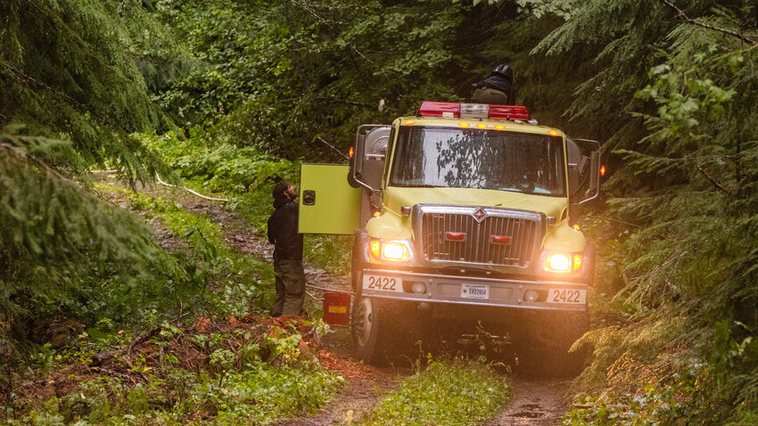 Fire crews respond to the Yew fire at the intersection of Forest Road 47 and Forest Road 4773 near Packwood on Thursday, Aug. 31.
