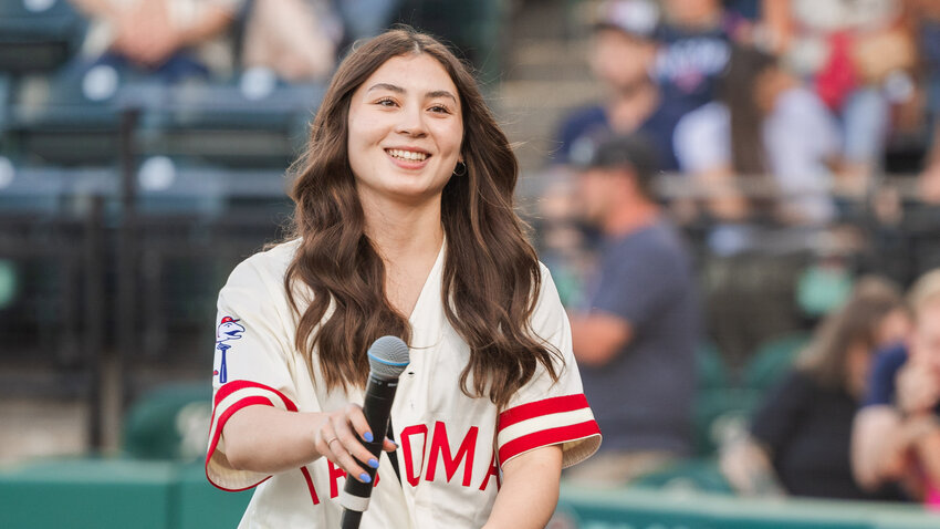 Centralia&rsquo;s Chihiro Bringman smiles after singing the National Anthem for a crowd at the Tacoma Rainiers&rsquo; Friday night game. Bringman attends Centralia High School and is a Running Start student.