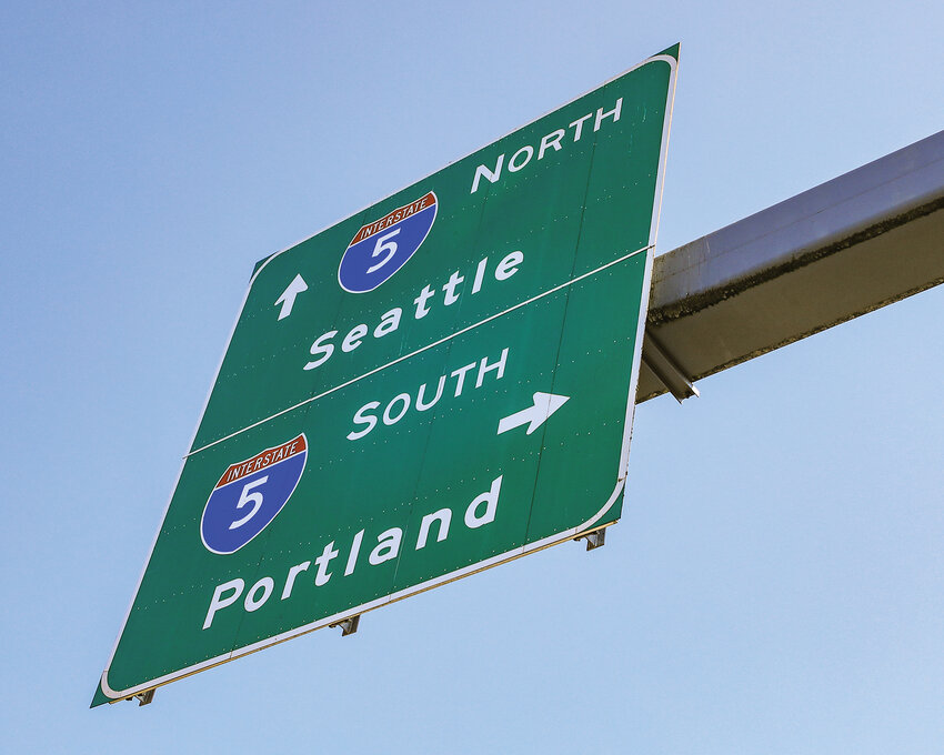 A sign on Interstate 5 in Clark County shows travelers directions. Starting Sept. 8, traffic on the northbound bridge of the interstate over the North Fork Lewis River will be reduced to two lanes for an expected two months for bridge repair.