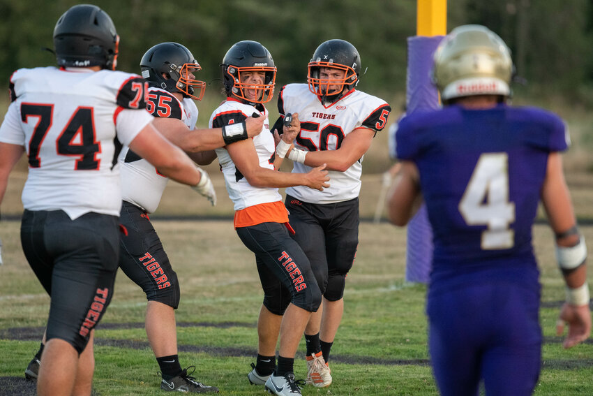 Ashton Demarest celebrates his 20-yard touchdown run in the first quarter of Napavine's game at Onalaska on Sept. 8.