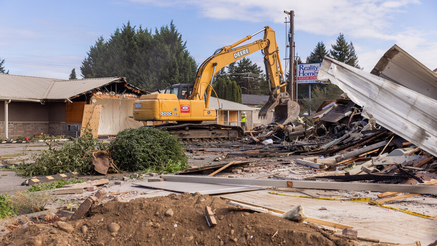 Crews work to tear down the remains of the Peppertree West Motor Inn off the Mellen Street exit in Centralia  on Tuesday, Sept. 19,  following a blaze that scorched the building last April. The property was sold to new owners in June. The new owner is listed as Centralia Top Holdings, LLC. The sale price was $2,577,035, according to the Lewis County parcels website. Jon Sitkin, of CSD Attorneys at Law in Bellingham, is listed as the governor of the LLC. The Chronicle reached out to Sitkin in July for details on the sale, including who the new owners are and what their plans for the Peppertree are, but he did not respond. As for the April fire, police arrested Todd H. Bergfalk, 52, of Onalaska, at the scene for allegedly setting the blaze.