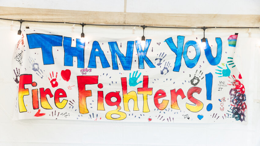 A sign hangs on display from local students for firefighters responding to the Cowlitz Complex fire near Packwood on Wednesday, Sept. 20.