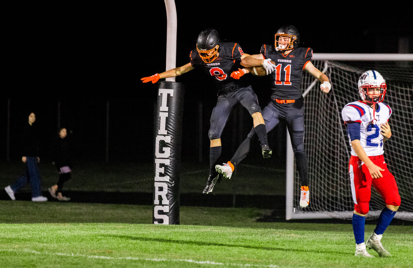 Napavine&rsquo;s Colin Shields (11) celebrates a touchdown with teammates during a Friday night game at home against the Pe Ell-Willapa Valley Titans.