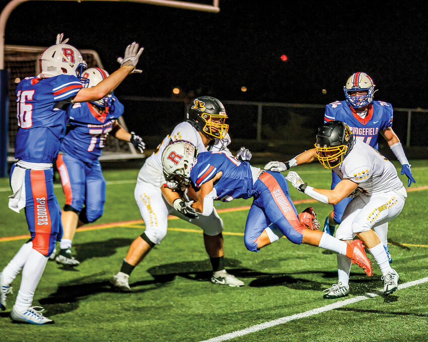 Ridgefield&rsquo;s Cly Stephens dives across the goal line for a third quarter touchdown in their 28-24 loss to Hudson&rsquo;s Bay High School on Friday, Sept. 22.