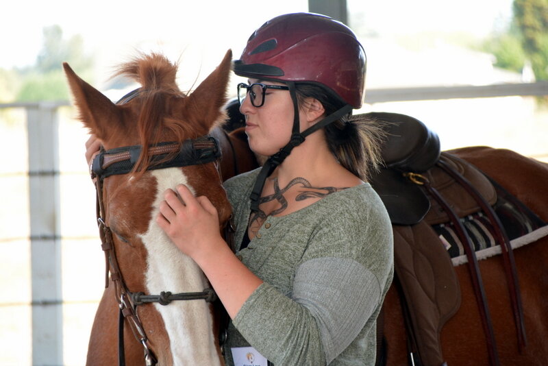 A woman works with a horse at Hope for Heroes Horsemanship Center in Yelm.