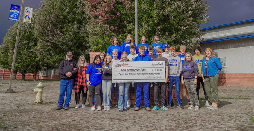 In no particular order, Adna Car Show organizers and volunteers Jim Smith, Cindy Smith, Angie Krause and Jen Krueger stand with student Adna Scholarship Committee members Nate Scheuber, Zane Powell, Braeden Salme, Brennen McCombs, Jordan Moon, Tanner Wagner, Lane Johson, Jens Neilson, Myra Medina, Lakoda South, Jana Dunnagan, Jessica Wickert, Kacie Andrrws, Margarite Humphrey, Elias Moerke, Avery Hagseth, Jacob Price, Emily Moerke, Tania Torres and Regan Nallion.&nbsp;