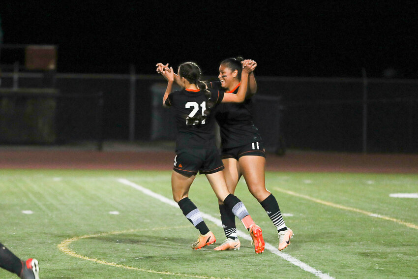 Olivia Gruginski (21) and Jaslin Corona (11) celebrate Gruginski's goal to open the scoring the the 26th minute of Centralia's 3-1 win over Black Hills on Sept. 28.