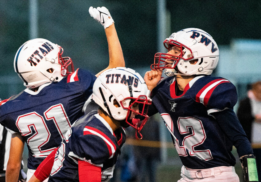 Pe Ell-Willapa Valley kicker Aiden Silva (21) and wide receiver Cody Mican (22) celebrate after a successful extra point against Morton-White Pass on Friday night in West Lewis County.