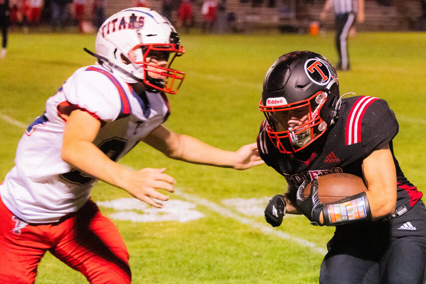 Toledo&rsquo;s Ethen Carver (8) braces for impact with Pe Ell-Willapa Valley&rsquo;s Lucas Lusk (24) at Ted Hippi Field on Friday, Oct. 6.