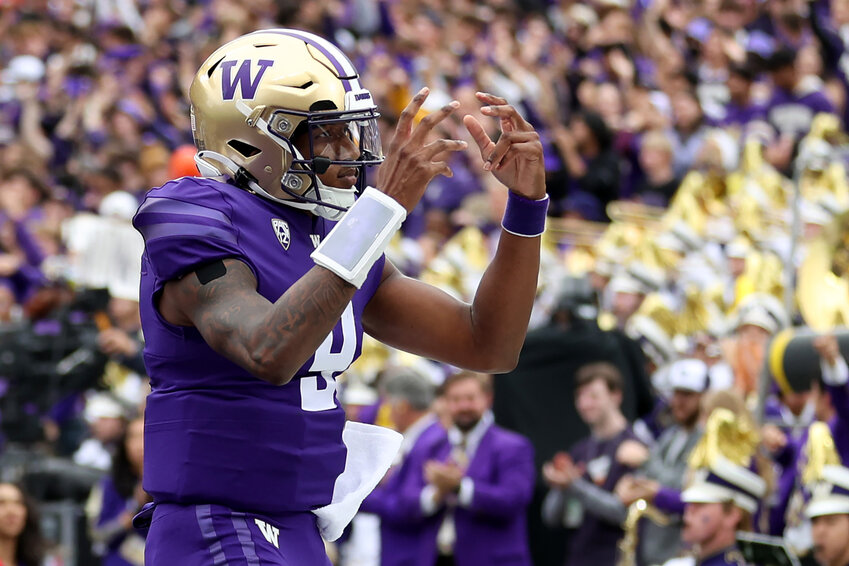 Michael Penix Jr. of the Washington Huskies celebrates a touchdown against the Oregon Ducks during the first quarter at Husky Stadium on October 14, 2023 in Seattle, Washington. (Photo by Steph Chambers/Getty Images/TNS)