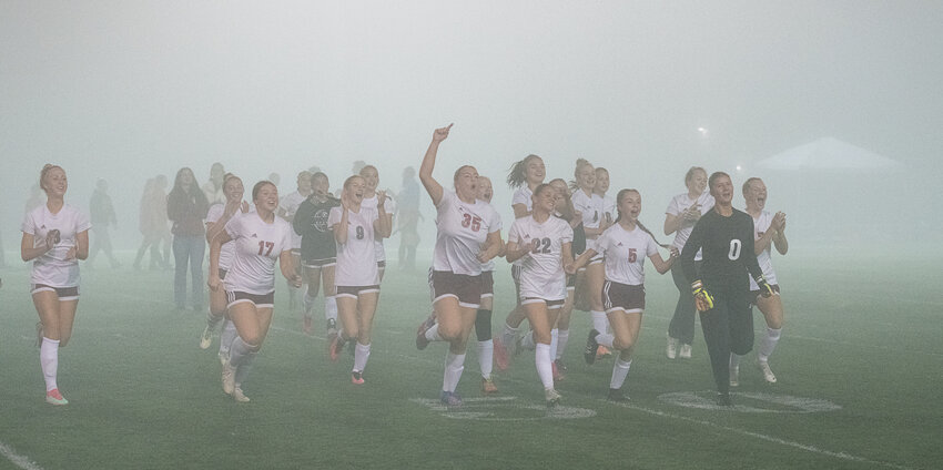 The W.F. West girls soccer team races to the Chronicle Cup after beating Centralia 1-0 at Tiger Stadium on Oct. 17.