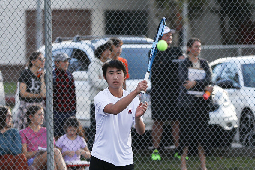 Javyn Han follows through with his swing after hitting a forehand during the second day of the 2A Evergreen tournament on Oct. 19.