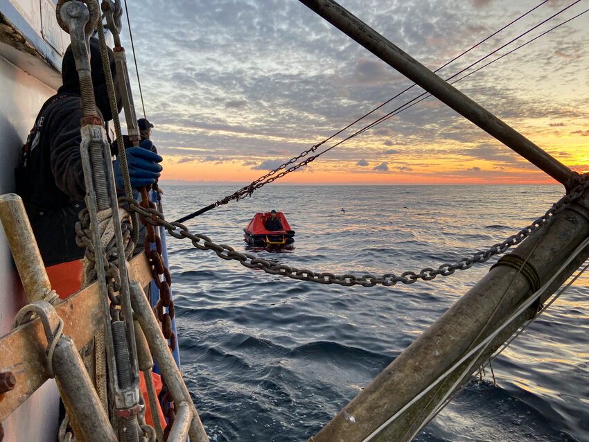 The rescued man, found in a life raft, was taken to shore and is stable, the Coast Guard said Thursday on the social platform X. The second man has not been found.