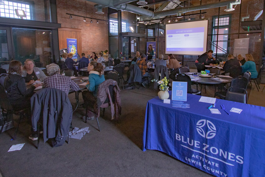 Blue Zones Activate Lewis County attendees discuss projects amongst themselves aimed at giving county residents easier access to healthier foods during a summit at the Centralia Train Depot on Oct. 10.
