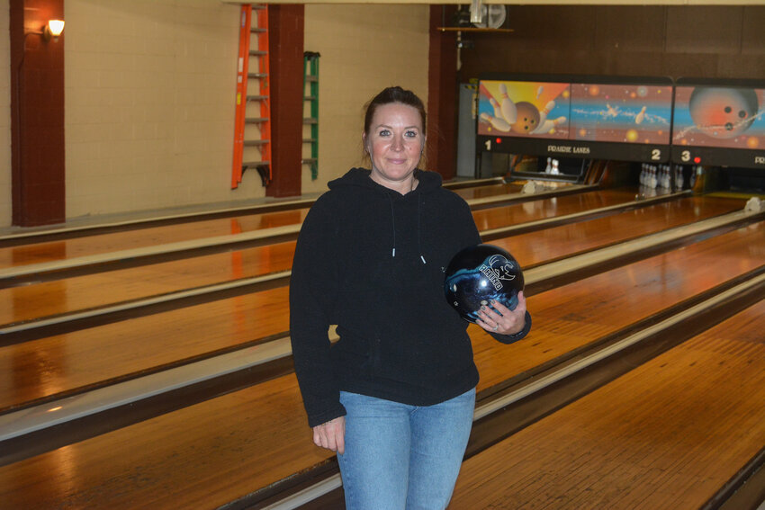 Averie Ford poses with a bowling ball at Yelm High School's girls bowling practice at Prairie Lanes on Nov. 6.